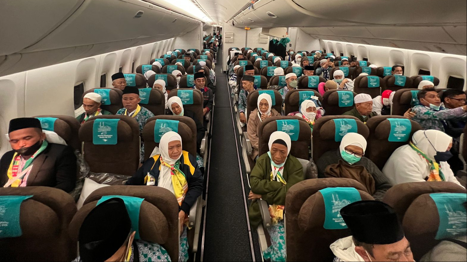 Ilustrasi jemaah haji dalam pesawat Garuda Indonesia (SinPo.id/ Kemenag)