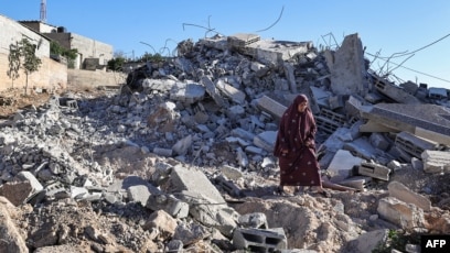 Reruntuhan rumah di desa Duma di Tepi Barat yang diduduki Israel (SinPo.id/AFP)