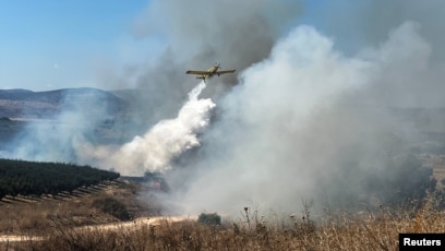 kebakaran akibat roket yang ditembakkan dari Lebanon ke Israel utara (SinPo.id/Reuters)