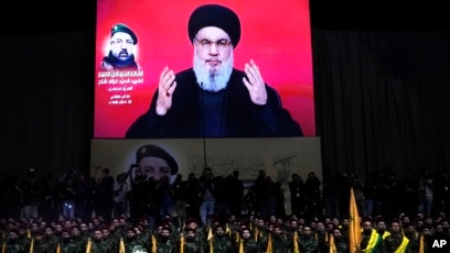 Pemimpin Hizbullah, Hassan Nasrallah memberikan pidato di layar televisi (SinPo.id/AP)