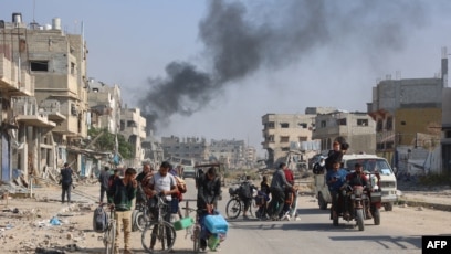 Warga Palestina yang mengungsi dari tempat penampungan di Beit Hanoun (SinPo.id/AFP)