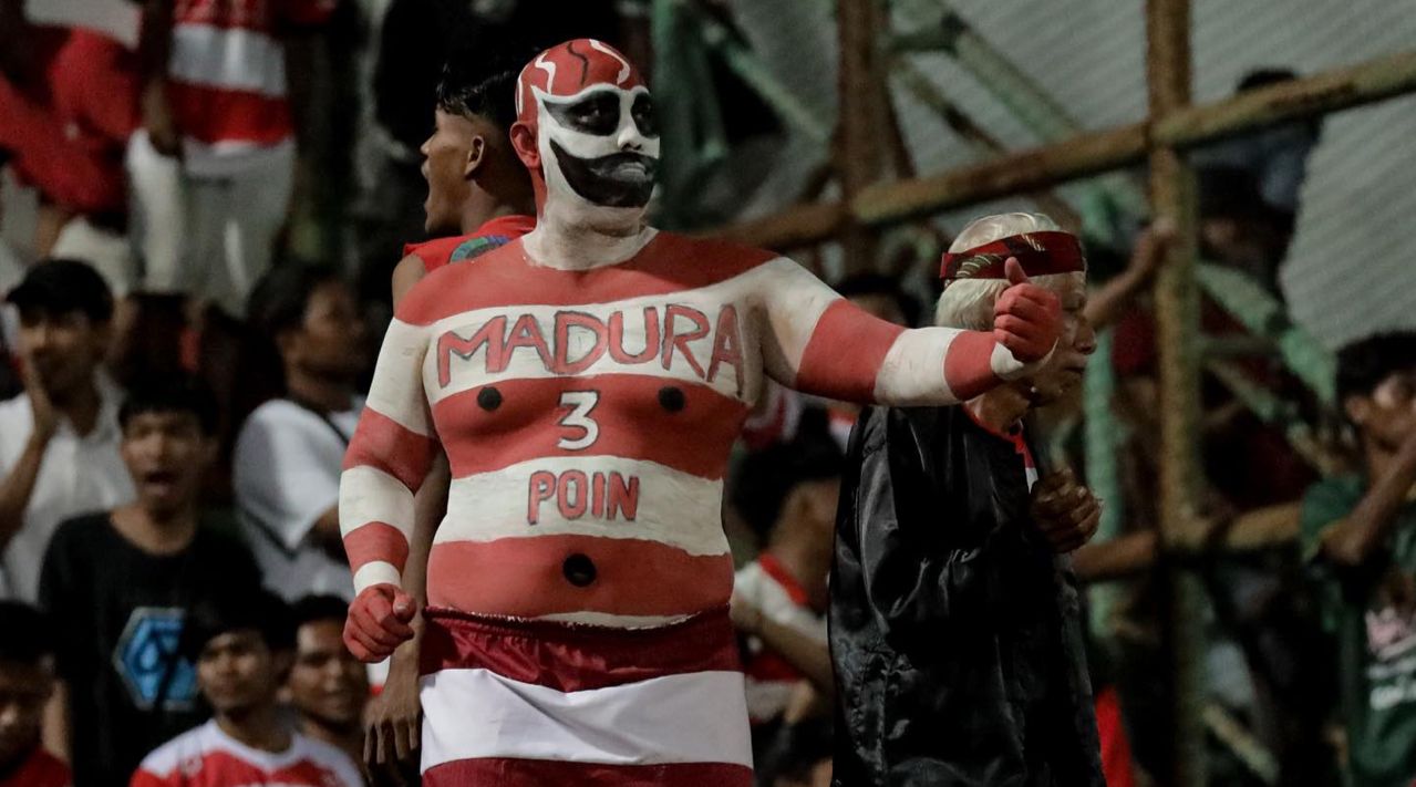 Ilustrasi. Suporter Madura United. (SinPo.id/maduraunitedfc)
