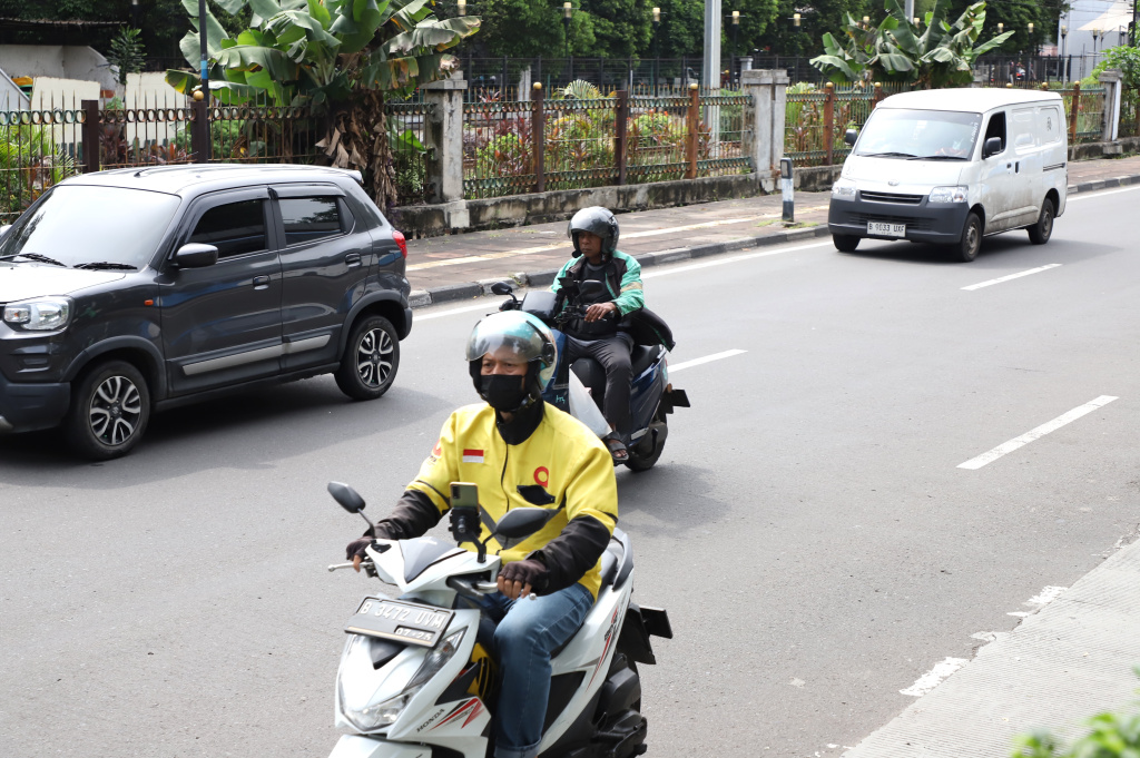 Pemerintah resmi menurunkan tarif potongan ojek online dari 20 persen menjadi 8 persen (Ashar/SinPo.id)