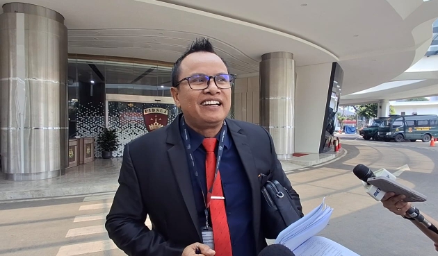 Penasihat hukum PT PMM Poltak Silitonga di Kejagung (SinPo.id/ Tangkapan layar)