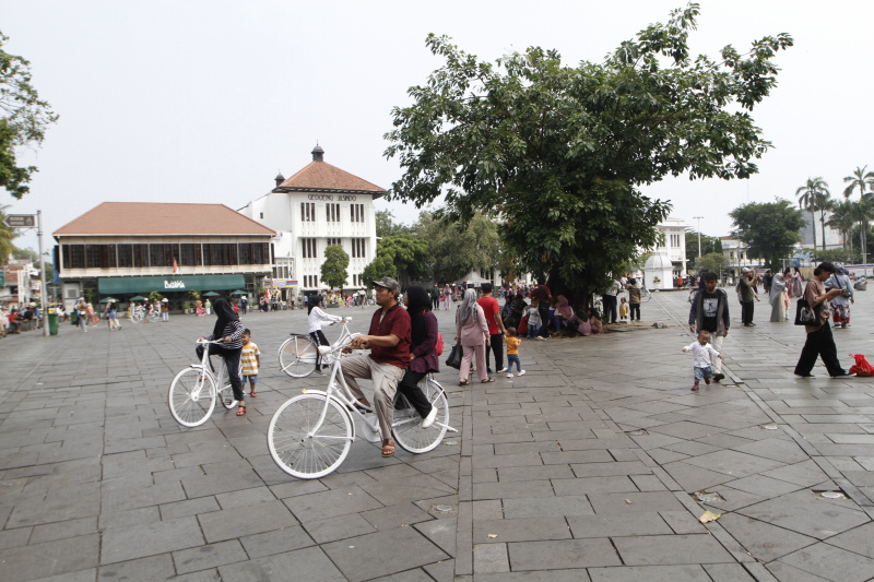 Wisatawan memadati tempat wisata Kota Tua Jakarta saat libur Natal dan Tahun Baru (Ashar/SinPo.id)