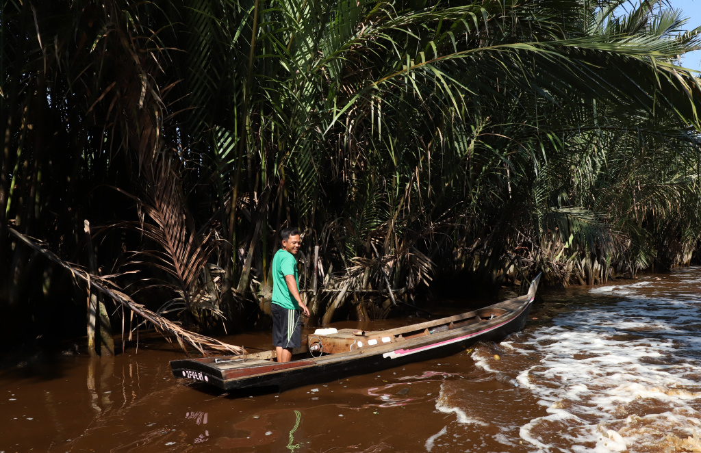 Melihat potret kehidupan warga desa Kuala Selat yang berpenghasilan dari nelayan petani Kelapa dan Mangrove (Ashar/SinPo.id)