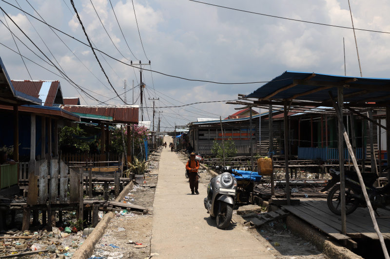 Melihat potret kehidupan warga desa Kuala Selat yang berpenghasilan dari nelayan petani Kelapa dan Mangrove (Ashar/SinPo.id)