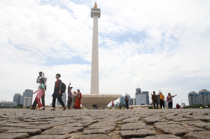 Monas dipadati oleh wisawatan saat liburan Nataru (Ashar/SinPo.id)