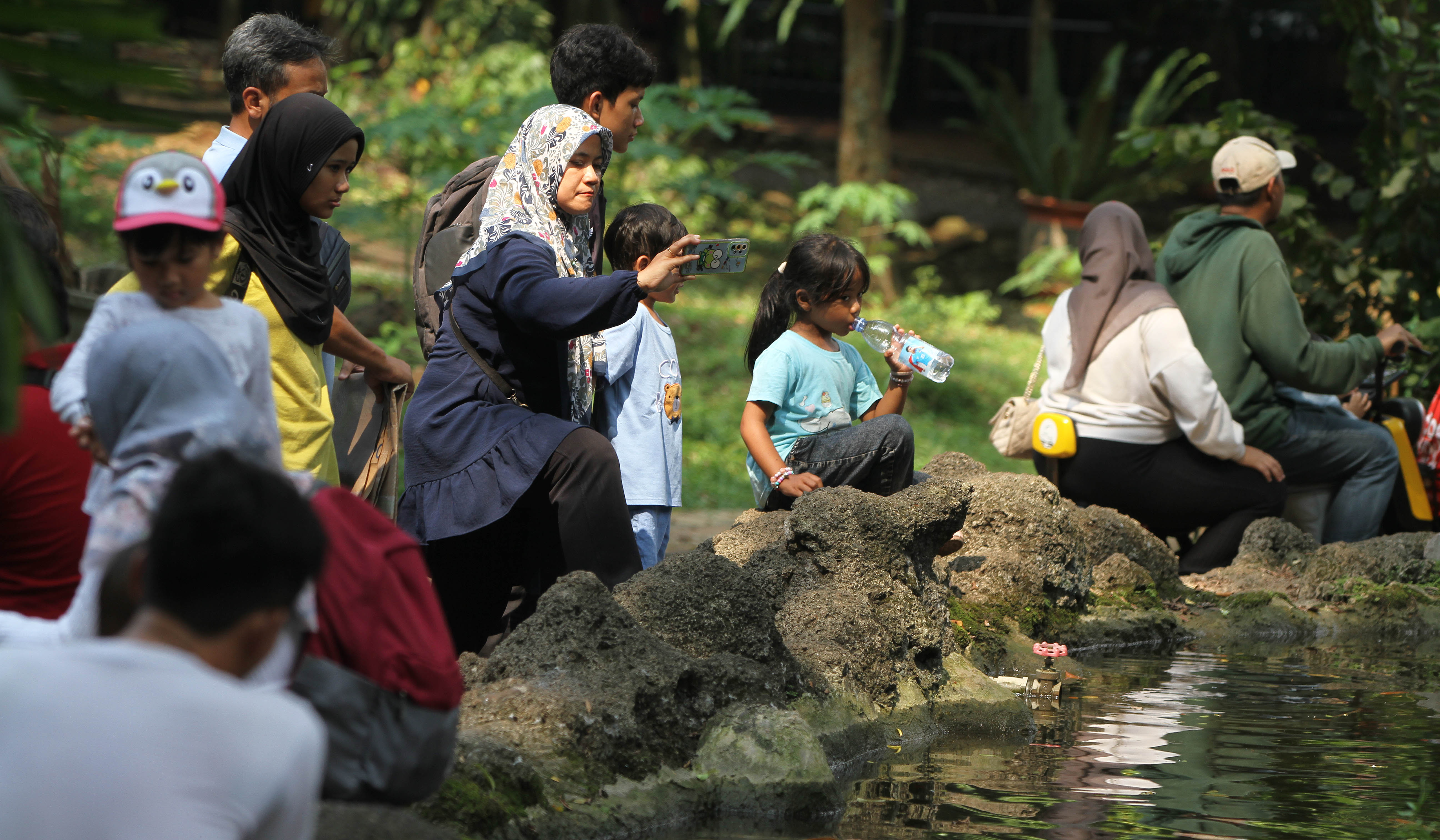 Ilustrasi pengunjung Taman Margasatwa Ragunan. (Agus Priatna/SinPo.id)